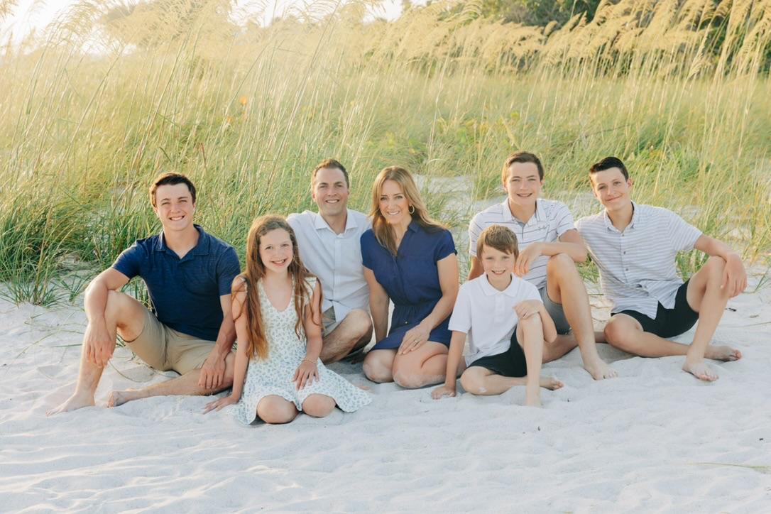 Coach Jenn Fawcett with her family at the beach